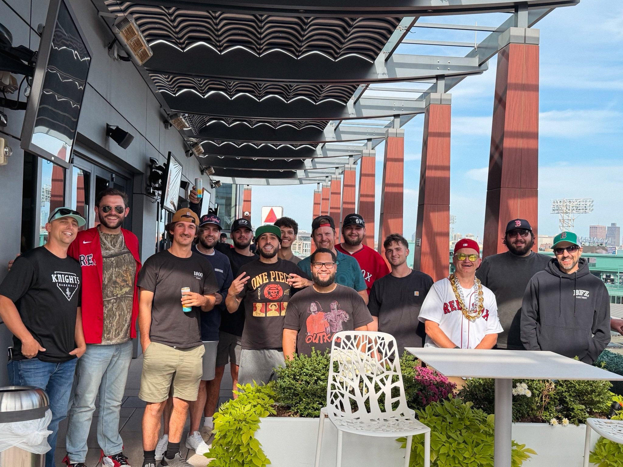 BFZ Electric team on a rooftop deck at Fenway