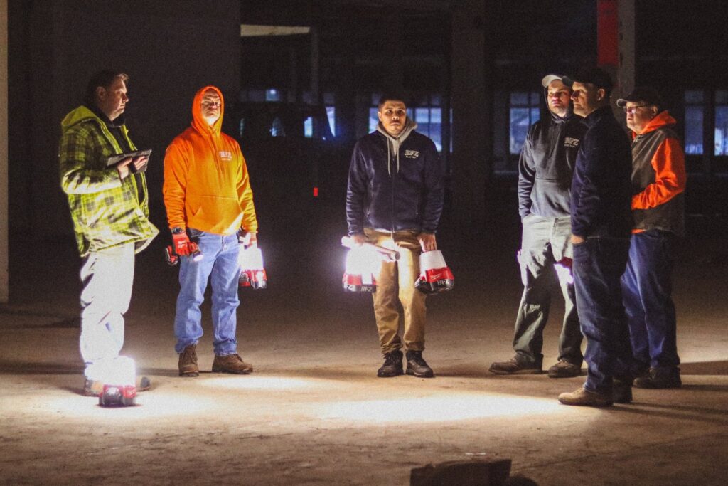 BFZ Electric crew planning during an initial site walk of an old warehouse