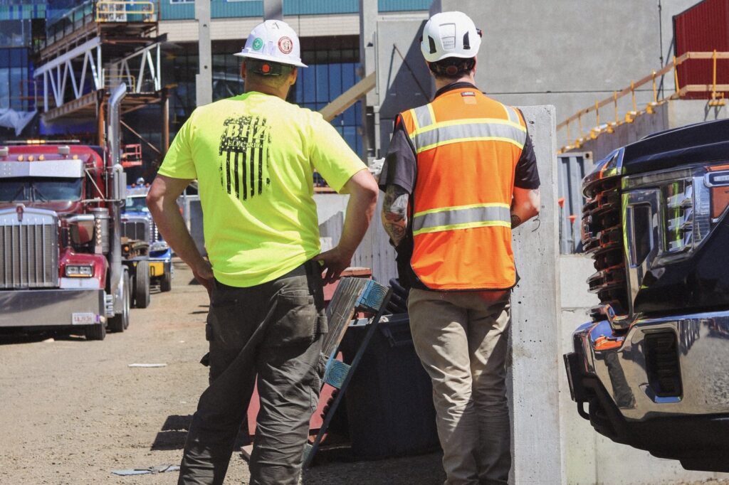 BFZ Electric team member coordinating with a project partner on an active construction site