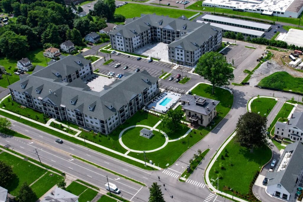 Aerial view of a multifamily apartment campus wired by BFZ Electric, with the next phase under construction
